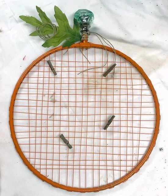 Repurposed Badminton Racket Pumpkin Photo Display
