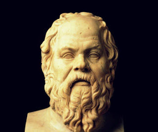 This is a statue of a bust of Socrates showing him as the "ugly" philosopher with the pug nose, etc. 