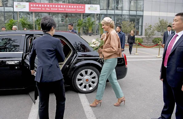 Queen Maxima and King Willem-Alexander of The Netherlands visit the Sino-Dutch Diary Development Center on October 25, 2015 in Beijing, China.