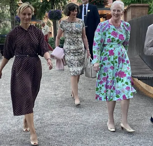 Queen Margrethe wore a green floral print chiffon dress, Princess Benedikte wore a red floral patterned dress