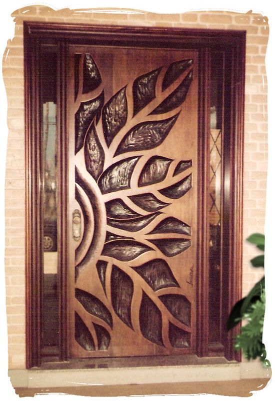 Unique wood front door. Modern art deco style double wood doors