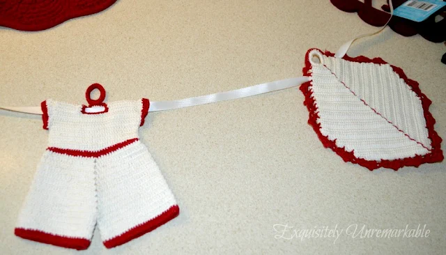 Red and white overall and leaf crocheted potholders