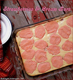 Strawberries and Cream Bars, a creamy cheesecake-like center studded with strawberries in a cookie dough crust and topping. | Recipe developed by www.BakingInATornado.com | #recipe #dessert