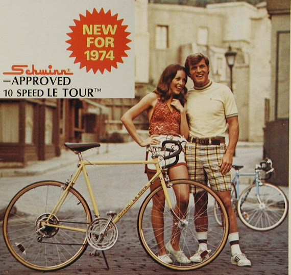 Man and woman in front of Schwinn Le Tour