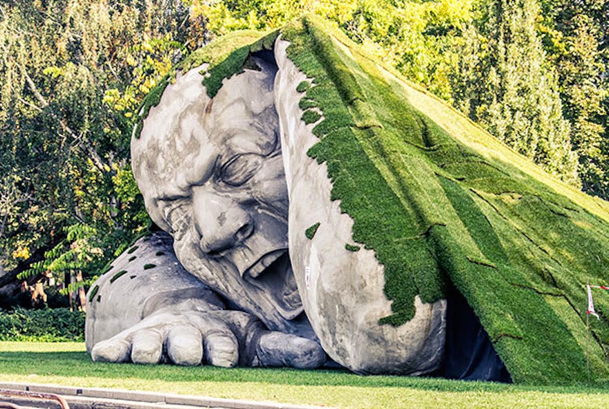 A Giant Sculpture Crawls Out Of The Ground In Public Square Of Budapest