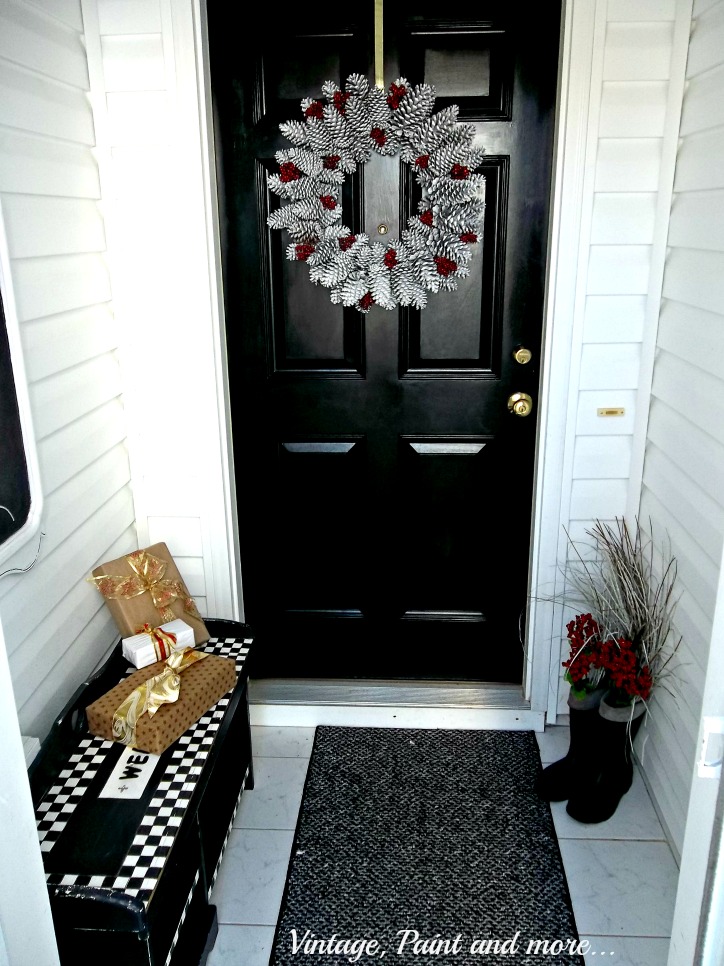 Vintage, Paint and more... Christmas entryway with pine cone wreath and packages from cereal boxes and brown parcel paper
