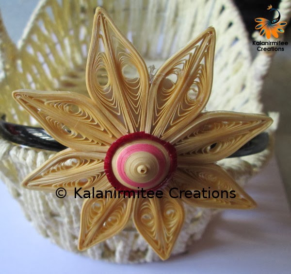 Quilled flowers for hairbands Kalanirmitee Creations