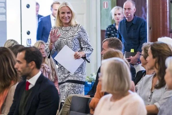 Princess Mette-Marit met with author Kjersti Annesdatter Skomsvold and author Geir Gulliksen. Mette-Marit is wearing baho print dress