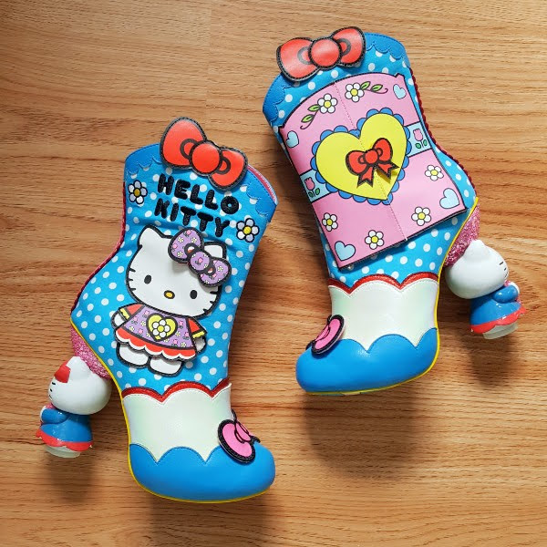 Hello Kitty ankle boots lying on wooden floor
