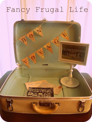 http://fancyfrugallife.com/vintage-suitcase-honeymoon-fund-wedding-decor-2/