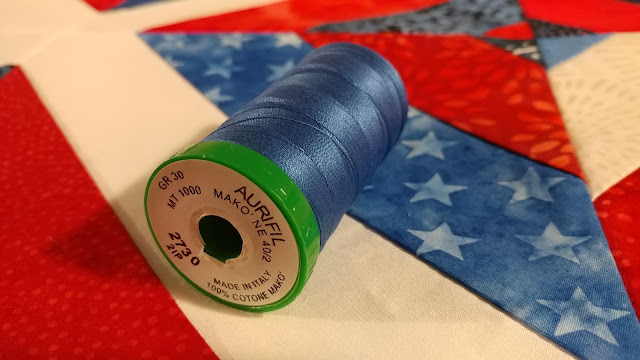 Red, white, and blue batik string quilt
