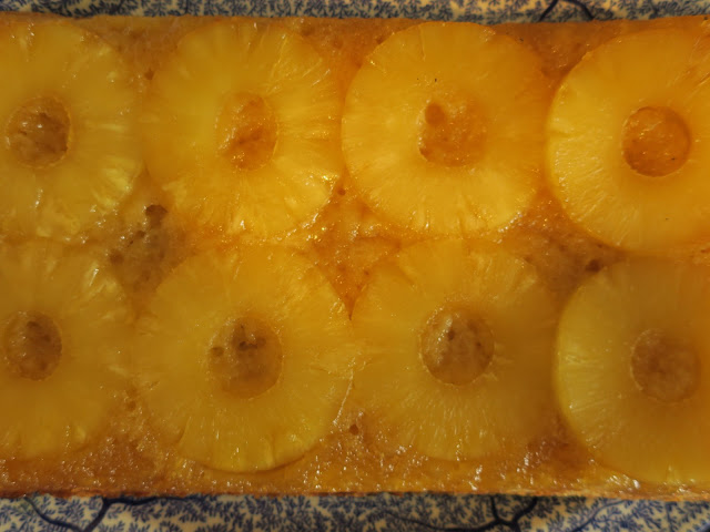Pineapple upside down pudding on blue and white plate