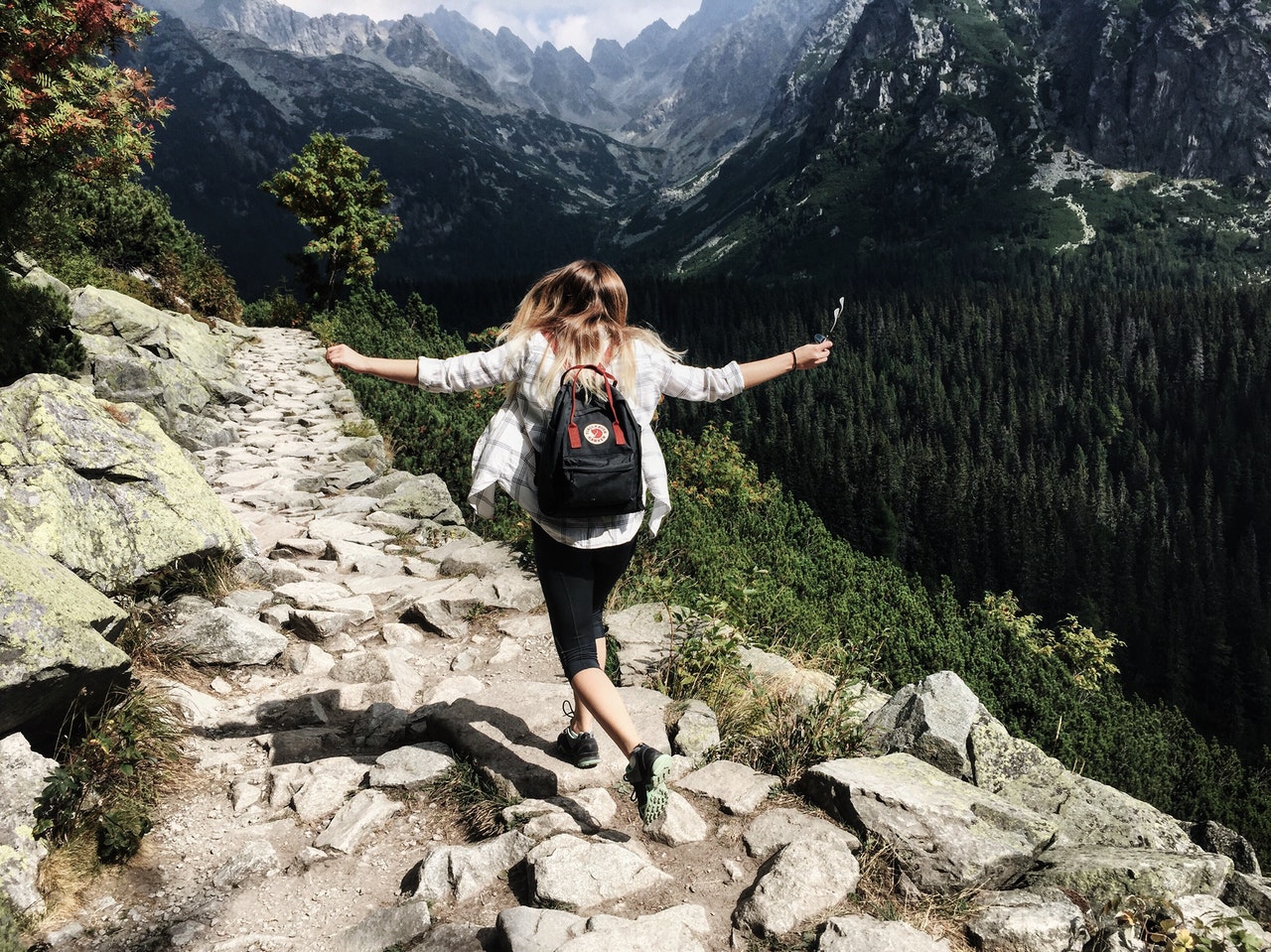 Happy lady hiking and living her best life