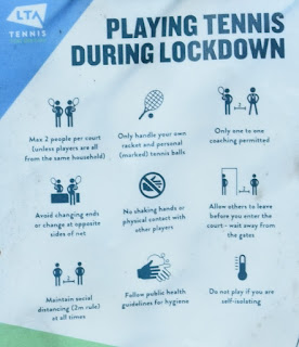 A sign with information on 'Playing Tennis During Lockdown' in Armstrong Park, Newcastle
