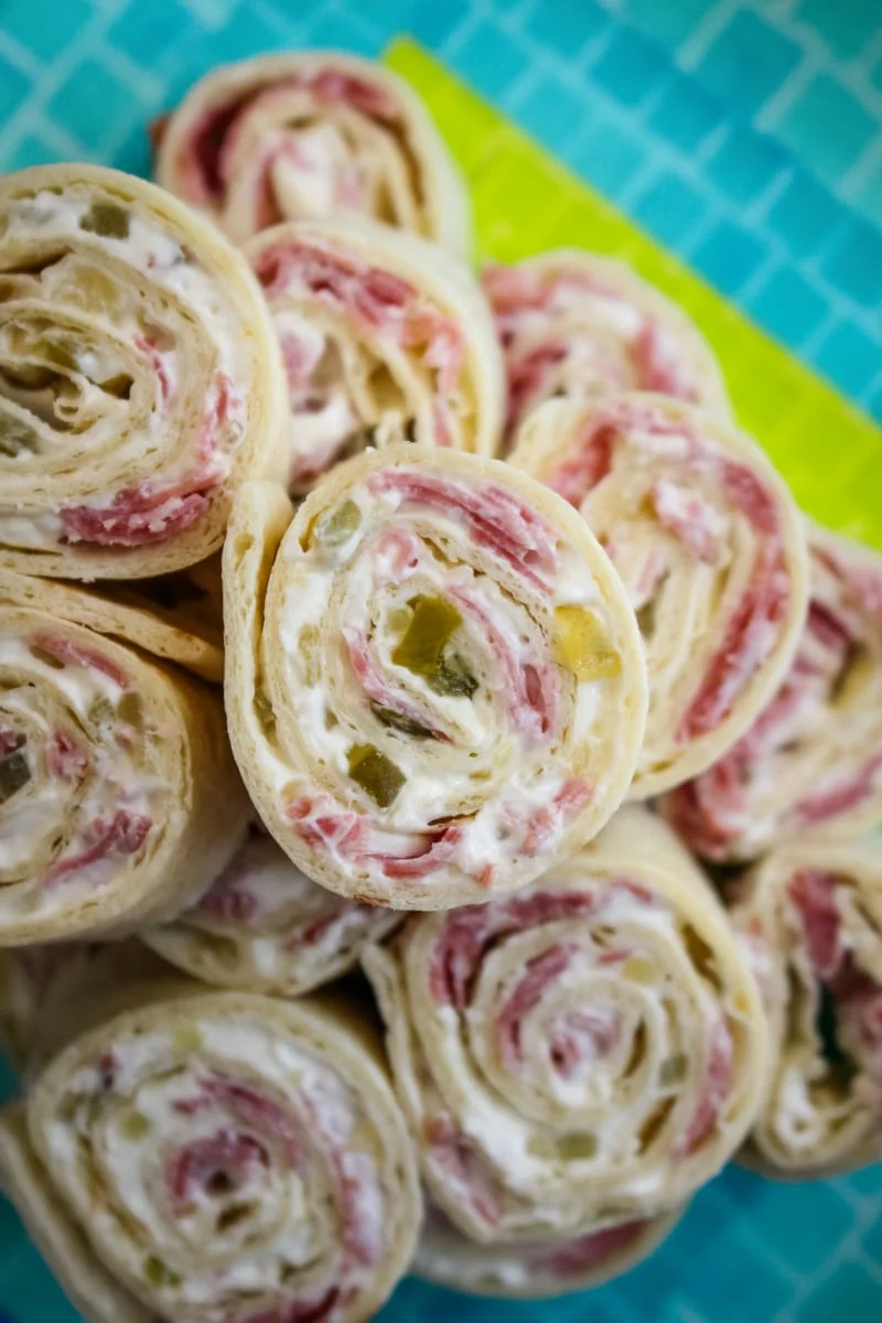 Salami Pinwheels are easy to make with just four simple ingredients! They make a fun and tasty snack, lunch, or party food. #salami #appetizer #fingerfood