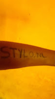 Susu's arm with "stylo.nl" written on it