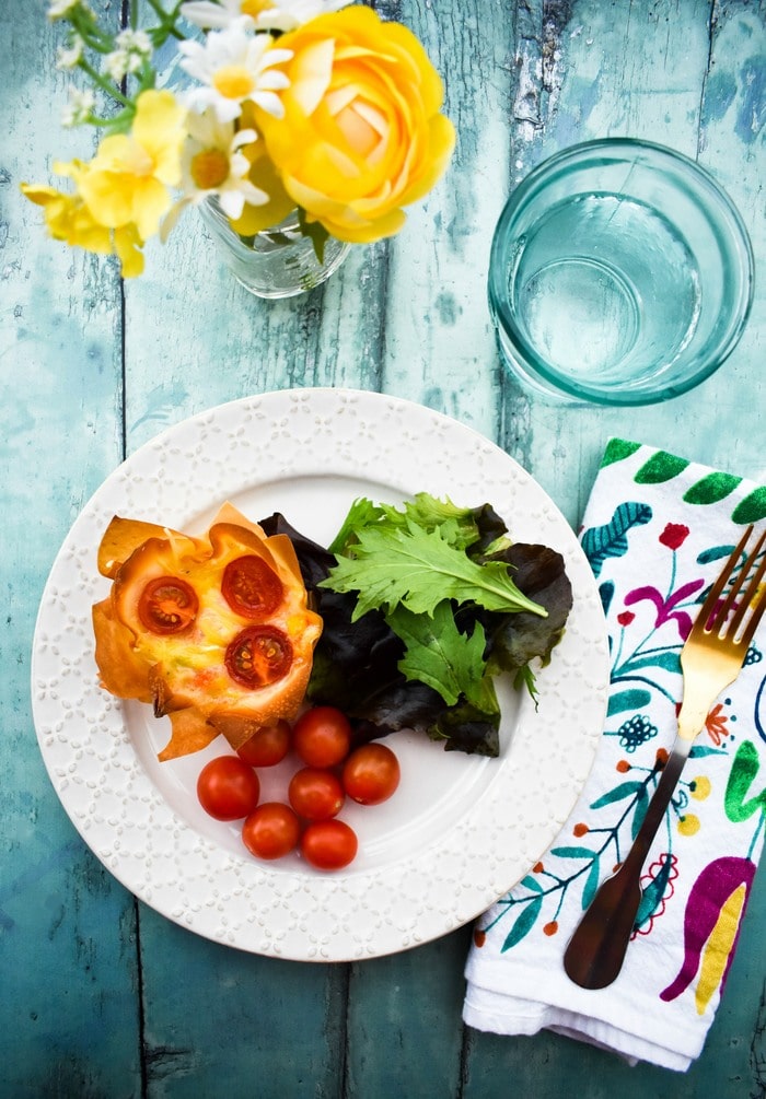 Vegan Cheese & Red Pepper Hand Pies on a white plate with salad