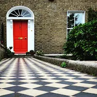 Photos of Dublin Doors: orange Georgian door with checkered tile