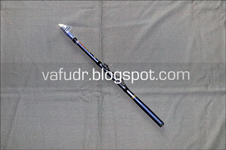 Telescopic Carbon Fiber Spinning Fishing Rod of dark grey color