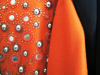 orange dress with metalic detail and mirrors