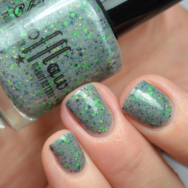 grey nail polish with green glitter swatch