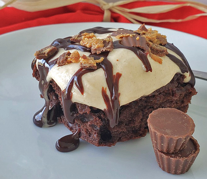 this is a decadent piece of  chocolate cake mix with a peanut butter creamy topping, hot fudge sprinkled with crushed peanut butter cups
