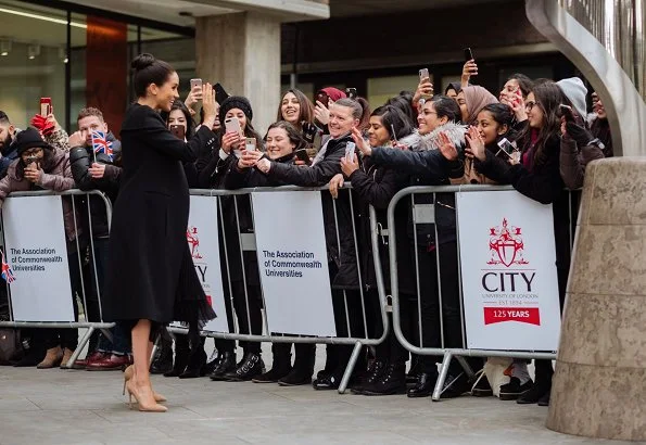 Meghan Markle wore a Bespoke Caplet Coat by Givenchy, and a new bespoke skirt