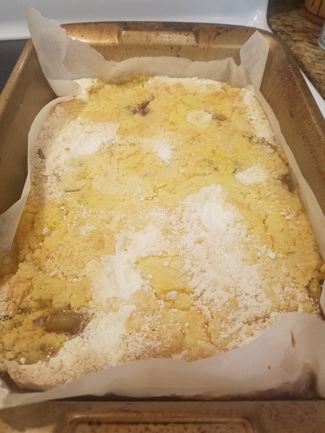 this is a 13 x 9 sheet cake pan with a baked dump cake in it. The cake has fruit on the bottom and the cake mix is dumped on top similar to a cobbler style dessert
