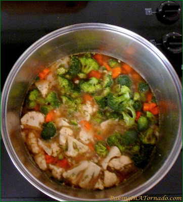 Creamy Vegetable Rice Soup is a cold weather staple. This hearty soup is made with fresh vegetables and brown rice, perfect for a warming winter lunch or dinner. | Recipe developed by www.BakingInATornado.com | #recipe #soup