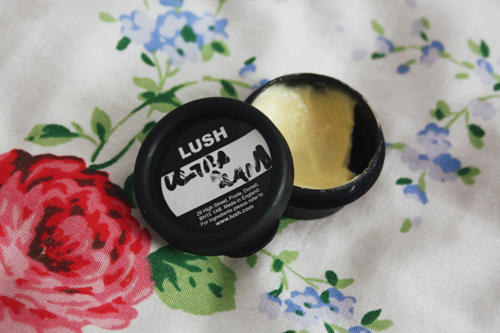 lush cosmetics ultrabland cleanser in a tester pot, with the lid open; the cleanser itself looks green in the pot