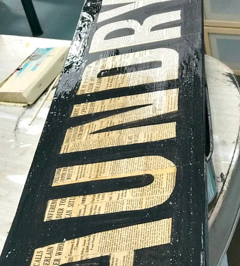 Coating the sign with a poly stain
