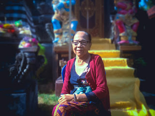 Happy Grandmother Sitting Under Morning Sunlight In The Middle Of Balinese Hindu Temple Ringdikit North Bali Indonesia