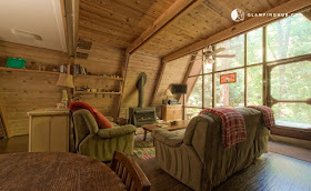 03-Living-Room-Glamping-Hub-A-Frame-House-Architecture-www-designstack-co