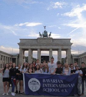 Brandenburg Gate in a Nazi poster and my students from the Bavarian International School during our 2018 annual trip.