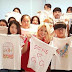 SNSD HyoYeon snap a group photo with her lucky fans