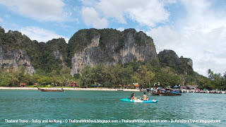 Kayak in front of cliffs by Railay
