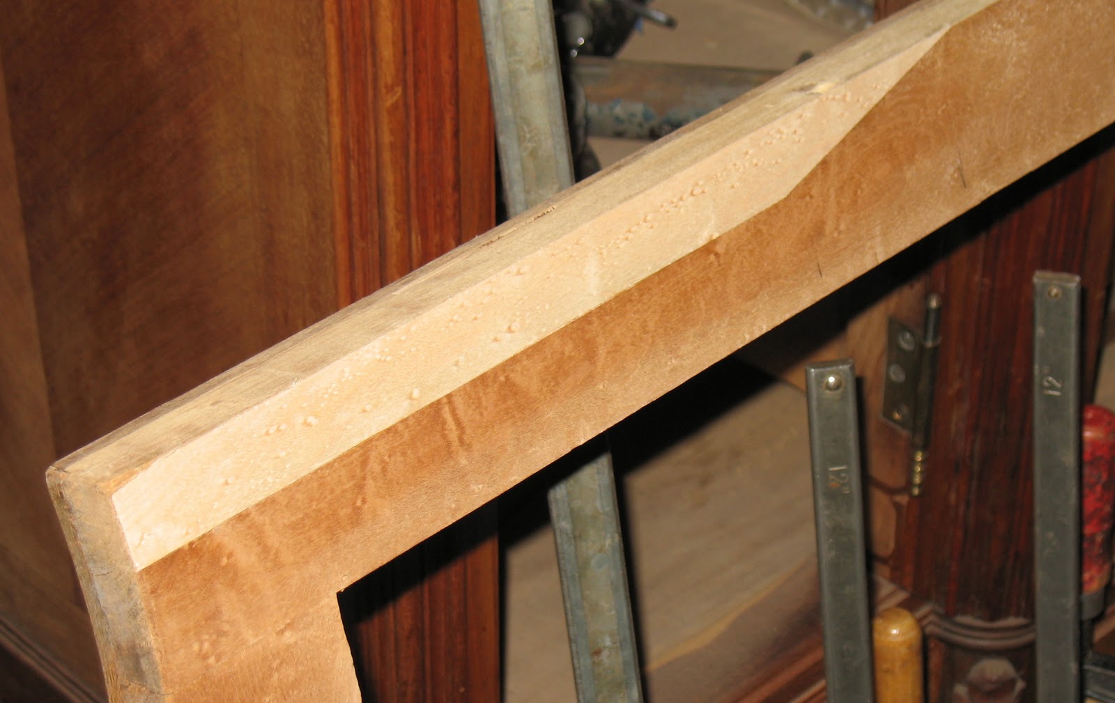 The Craftsman Repair to Veneer on Water Damaged Armoire