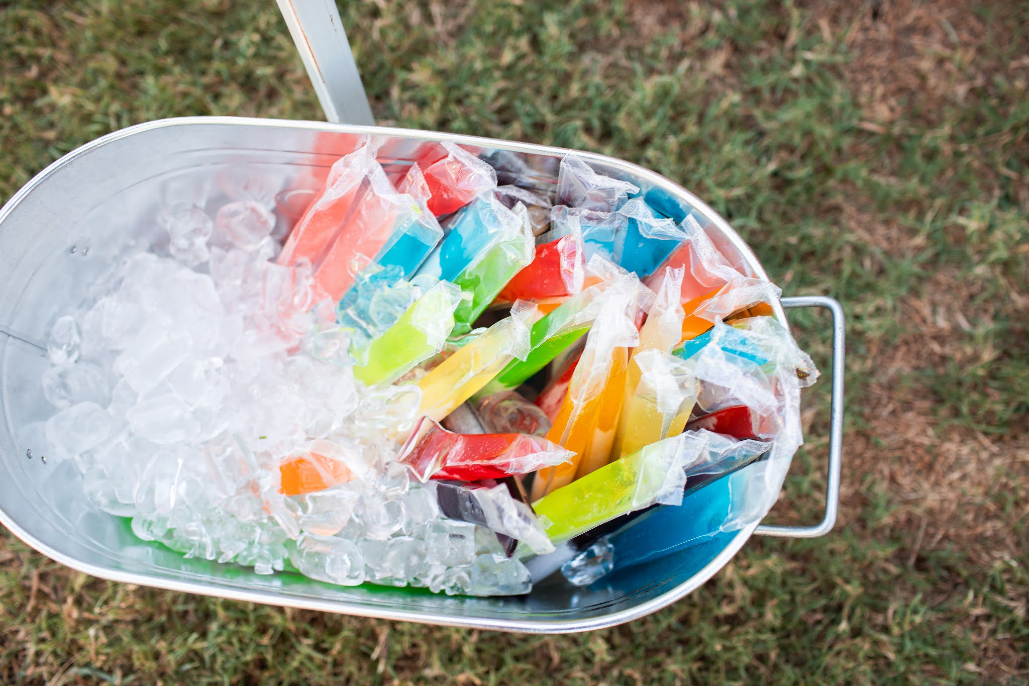 Outdoor birthday party with ice bucket and popsicles for kids