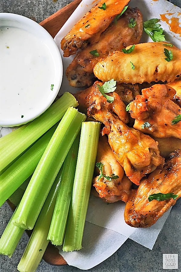 Low Carb Buffalo Wings with Gorgonzola cheese dipping sauce and a side of celery sticks ready to enjoy for game day!