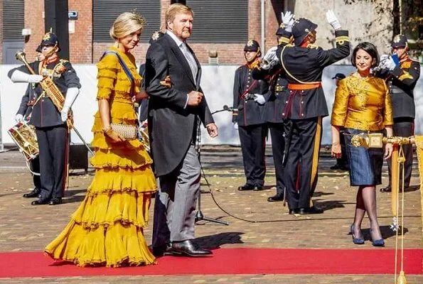Queen Maxima wore a yellow dress from Claes Iversen Haute Couture SS17 collection. Bottega Veneta intrec knot clutch
