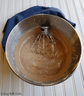 mixer bowl filled with creamy chocolate pie filling