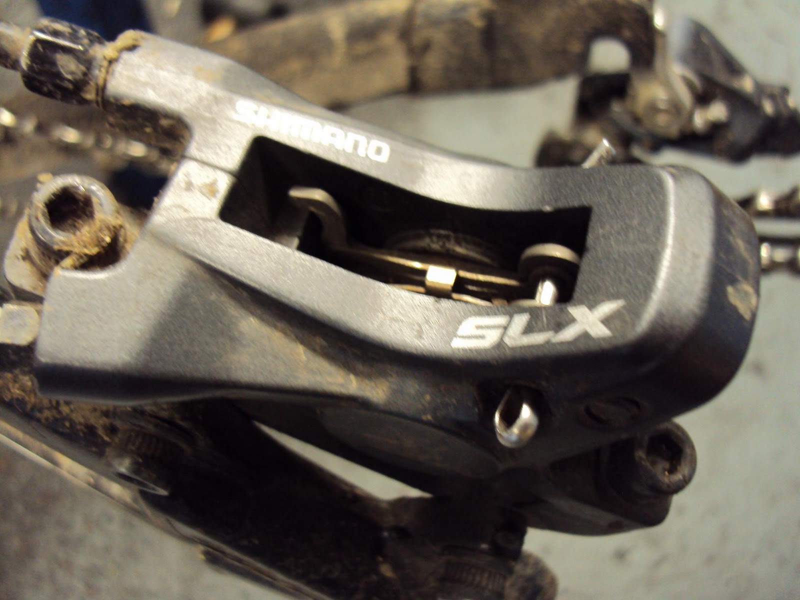 András Gercsényi XC Mountain Biker Cleaning disc brake calipers