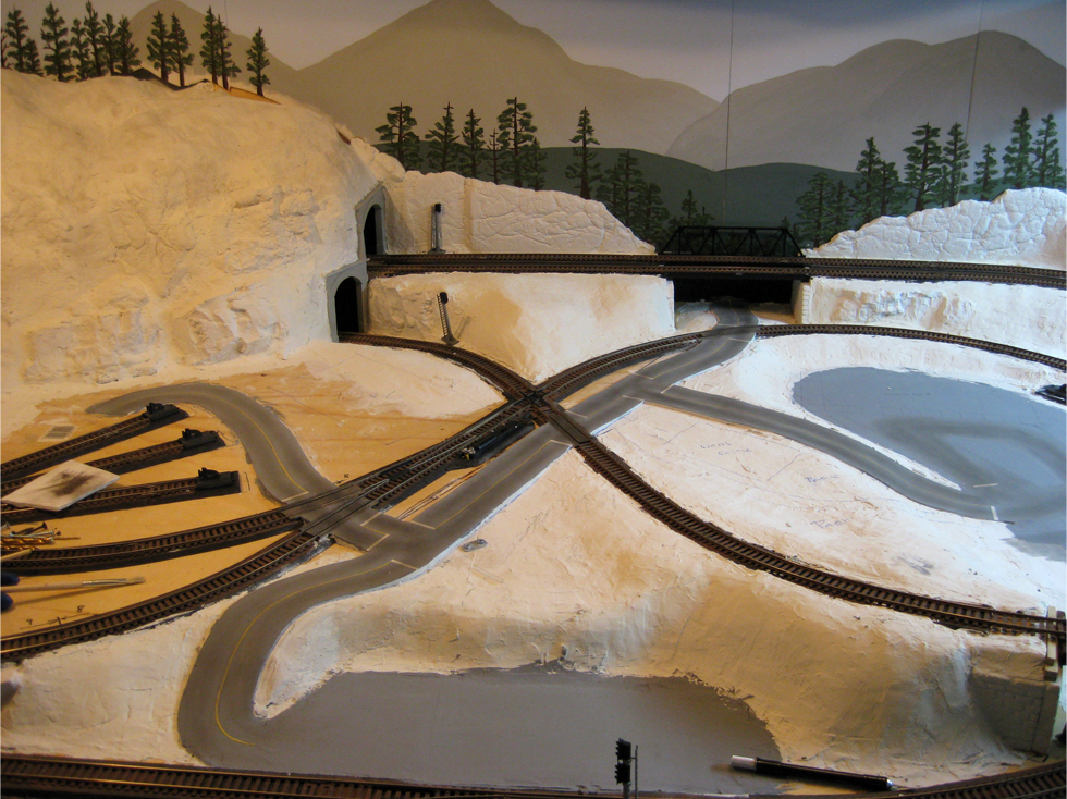 Completed model railroad plaster roads made from Smooth-It plaster and weathered with powdered pastels