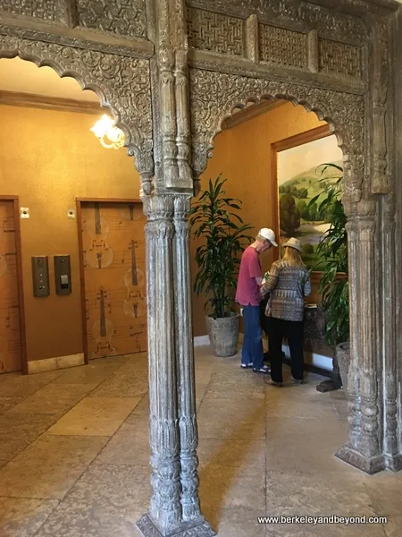 repurposed ancient doorway by elevators at Allegretto Vineyard Resort in Paso Robles, California