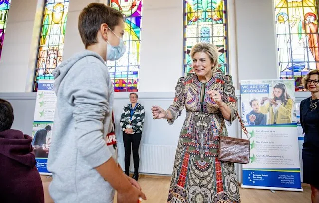 Princess Laurentien wore a free spirit print long sleeve midi dress from Etro. The school is located in the building of the Aloysius College