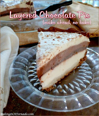 Layered Chocolate Pie is a no bake dessert. Layers of chocolate and white chocolate pudding are assembled with flavored whipped cream. Make ahead and no bake! | Recipe developed by www.BakingInATornado.com | #recipe #dessert