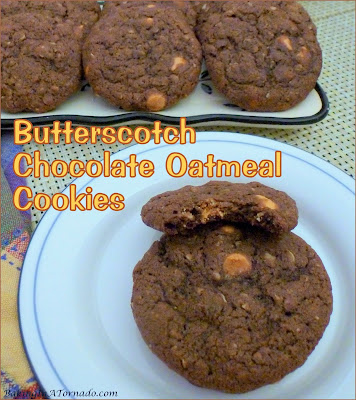 Butterscotch Chocolate Oatmeal Cookies are crispy on the outside, chewy on the inside chocolate flavored oatmeal cookies studded with little bursts of butterscotch. | Recipe developed by www.BakingInATornado.com | #recipe #cookies