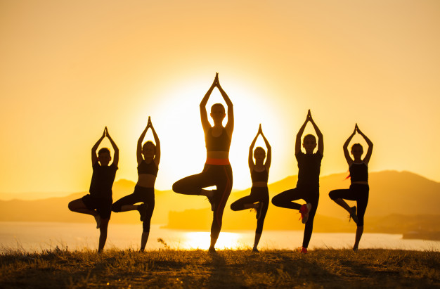 group-children-are-engaged-yoga-with-trainer-ocean_110955-452.jpg