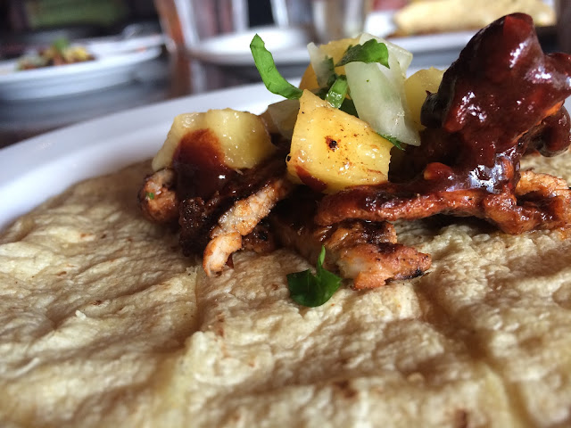 Tacos Al Pastor: Shaved Pork, Grilled Pineapple, Cilantro, and Onion