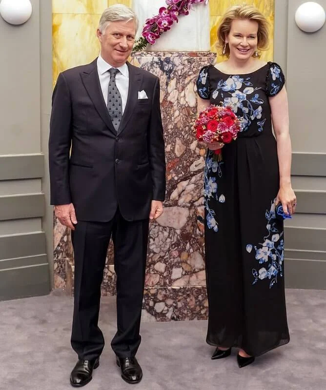 Queen Mathilde wore a floral embroidered black dress drom Dries Van Noten. Emporio Armani floral-embroidered dress